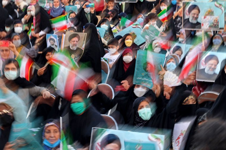 Image: Supporters of Iranian presidential candidate Ebrahim Raisi attend an election campaign rally in Tehran, Iran, on June 14, 2021.