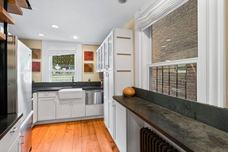 The home mixes modern conveniences (hello, new kitchen!) with old-world charm, listing agent Carmela Laurella said. 