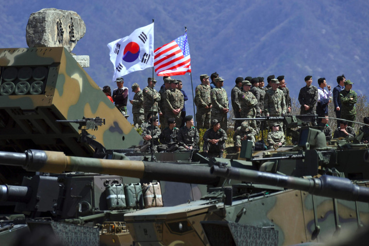 Image: South Korean and US soldiers watching from an observation post during a joint live firing drill between South Korea and the US at the Seungjin Fire Training Field in Pocheon, northeast of Seoul