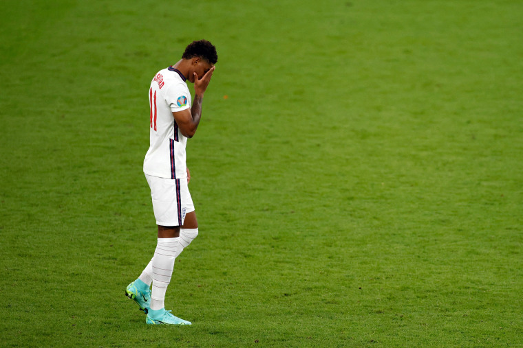 Image: England's forward Marcus Rashford reacts after missing in the penalty shootout during the UEFA EURO 2020 final football match between Italy and England at the Wembley Stadium in London on July 11, 2021.