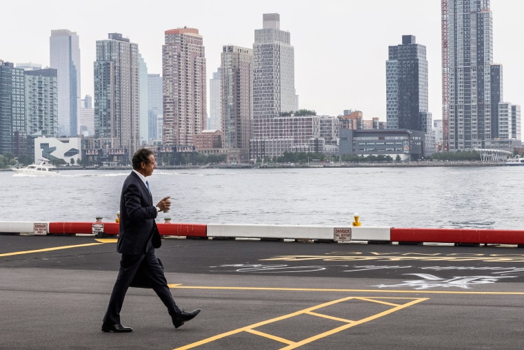 Image: New York Governor Andrew Cuomo walks to his helicopter after announcing his resignation in Manhattan, New York City