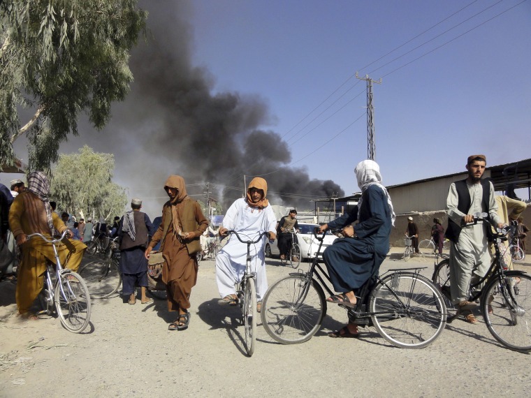 Image: Smoke rises after fighting between the Taliban and Afghan security personnel, in Kandahar, southwest of Kabul, Afghanistan