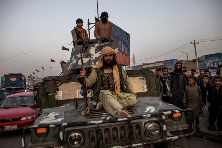 Image: Taliban fighters on a Humvee after entering Kabul on Sunday.