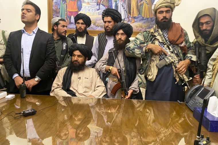 Taliban fighters take control of Afghan presidential palace after the Afghan President Ashraf Ghani fled the country in Kabul on Aug. 15, 2021.