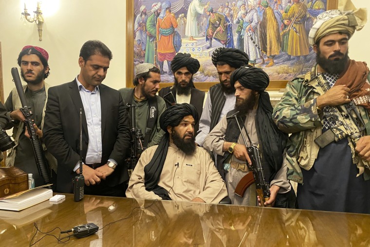 Taliban fighters take control of Afghan presidential palace after the Afghan President Ashraf Ghani fled the country in Kabul on Aug. 15, 2021.