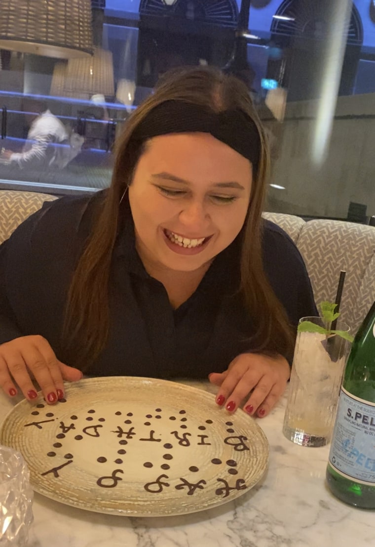 Natalie Te Paa with her surprise birthday message at Luciano by Gino D’Acampo in London.