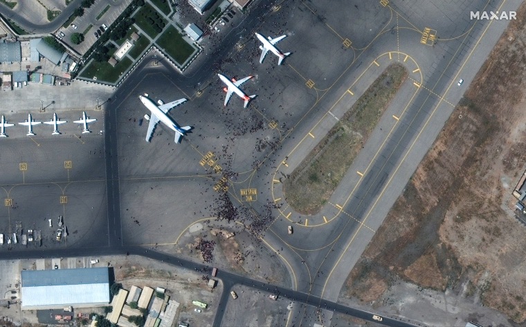 The chaotic scene underway at Kabul's Hamid Karzai International Airport in Afghanistan as thousands of people converged on the tarmac and airport runways as countries attempt to evacuate personnel from the city.