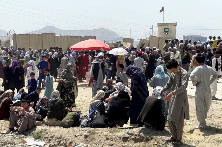 People wait outside Hamid Karzai International Airport in Kabul, Afghanistan, on Aug. 17, 2021.