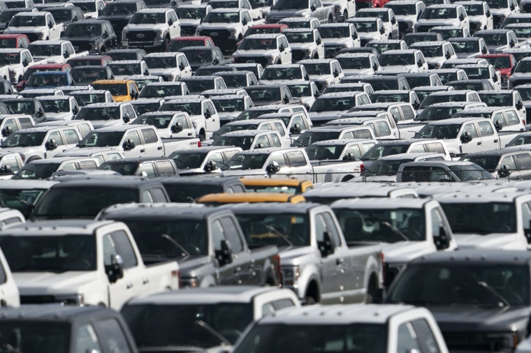 New unfinished Ford F-Series pickup trucks are stored in a lot during a semiconductor shortage at Kentucky Speedway in Sparta, Ky., on July 16, 2021.
