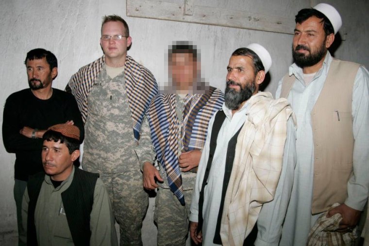IMAGE: An Afghan interpreter stands next to former Army Capt. Jeff Trammell