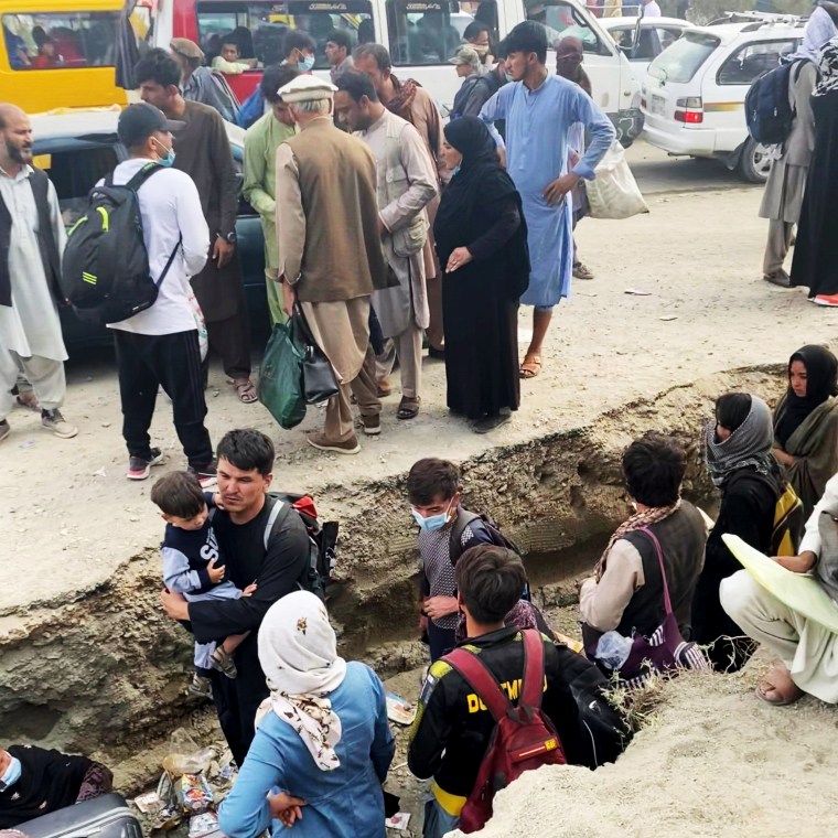 Image: Families gather outside Kabul airport