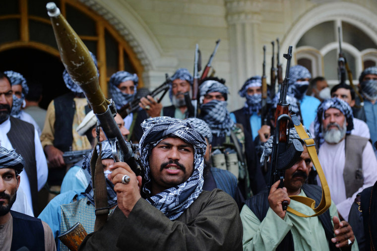 Militia members gather at the house of Afghan warlord and former Mujahideen leader Ismail Khan in Herat, Afghanistan, on July 9, 2021.