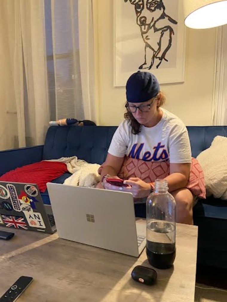 Jen Wilson in her apartment in New York City answering texts from retired and active duty service members  desperate for any help getting Afghans out of the country.