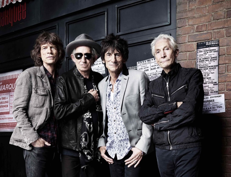 The Rolling Stones' Mick Jagger, Keith Richards, Ronnie Wood and Charlie Watts pose in front of The Marquee Club in London on July 11, 2012.