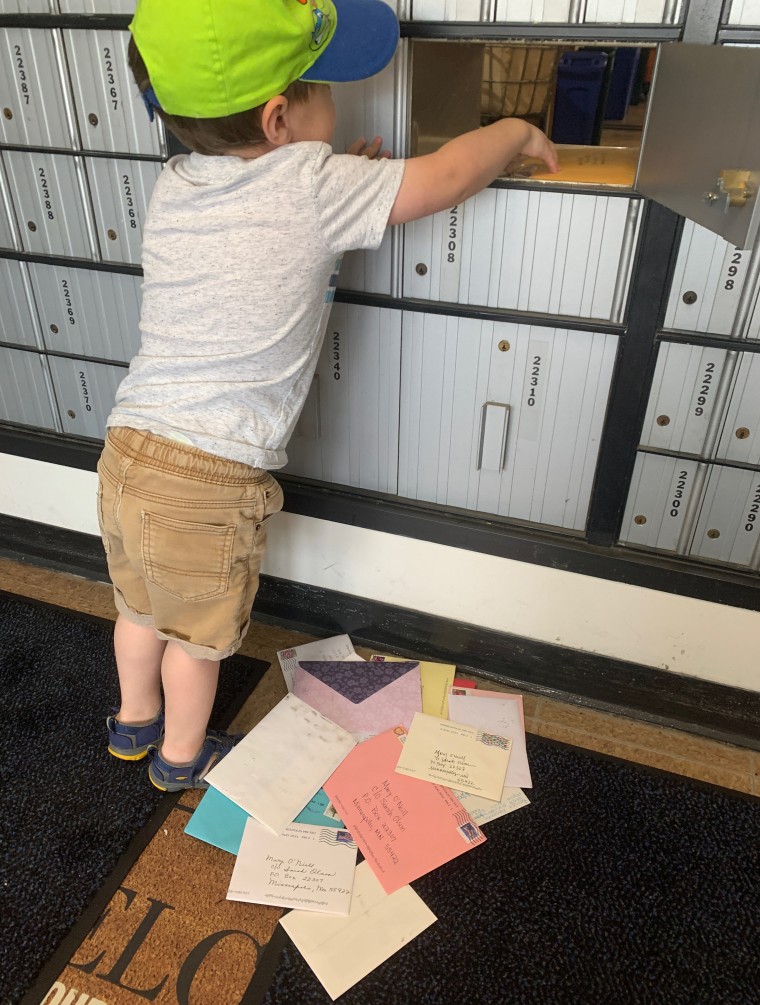 Benjamin Olson dutifully checks a post office box for birthday cards for his best friend and neighbor, Mary O'Neill. 