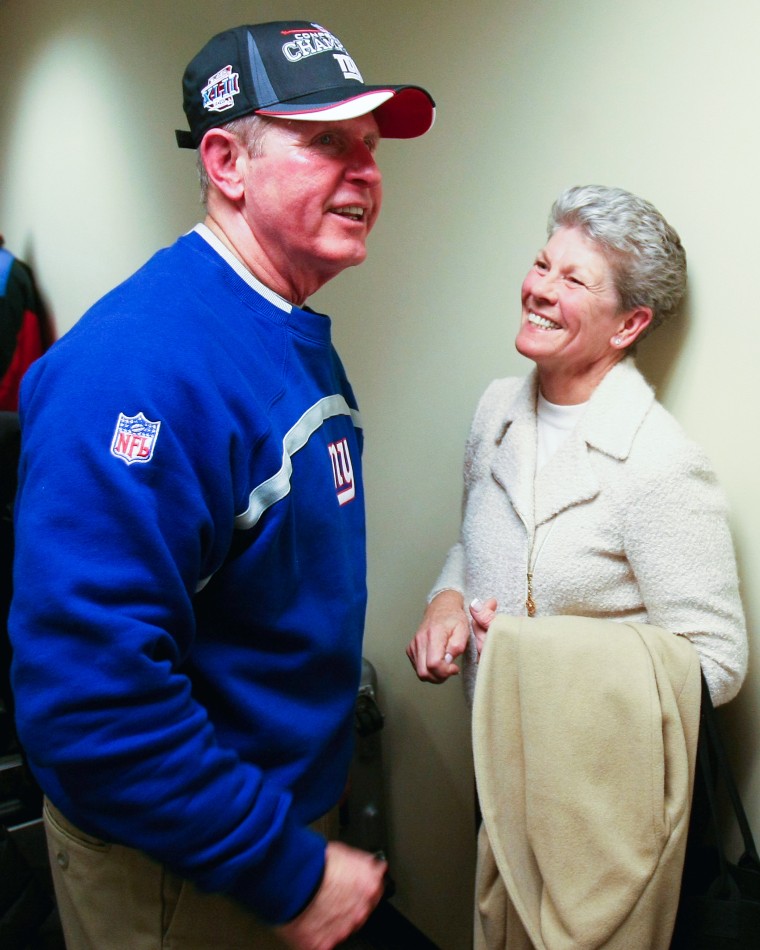 Head coach Tom Coughlin of the New York Giants celebrates with his wife Judy Coughlin