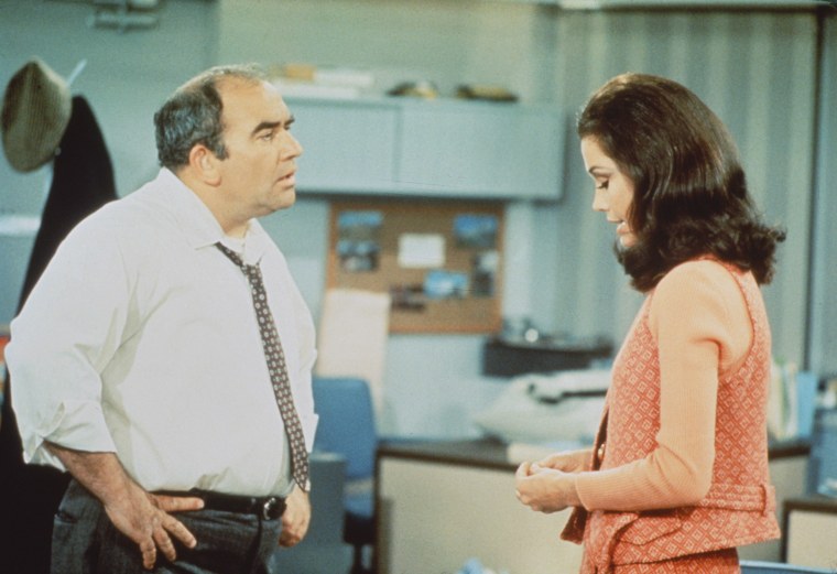 American actors Edward Asner (as Lou Grant) and Mary Tyler Moore (as Mary Richards) in a scene from 'The Mary Tyler Moore Show' (also known as 'Mary Tyler Moore'), Los Angeles, California, 1970.