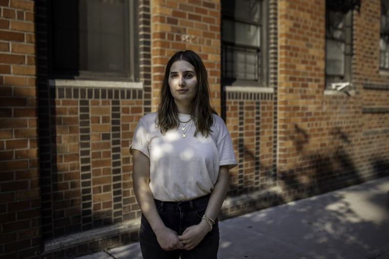 Image: Jasmine Perillo outside a building where she couldn't get an apartment in the Chelsea neighborhood of New York City on Aug. 12, 2021.