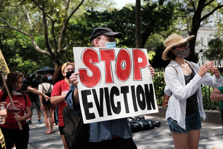 Activists hold a protest against evictions near City Hall on Aug. 11, 2021, in New York.
