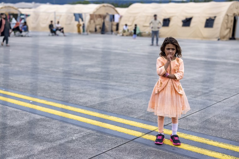 Image: A young Afghan evacuee at a camp in Ramstein Airbase