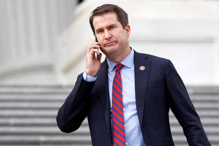 Image: Rep. Seth Moulton descends the House entrance stairs in Washington on March 12, 2020.