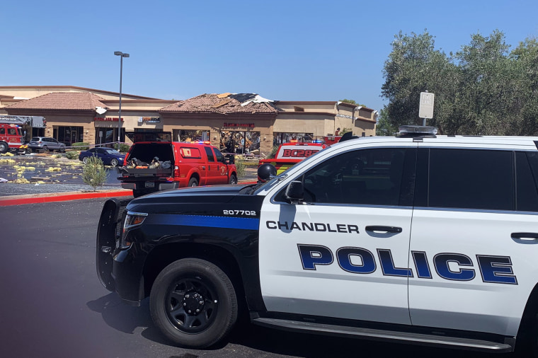 Police at the scene of a roof collapse in which four people were injured in Chandler, Ariz., on Thursday.