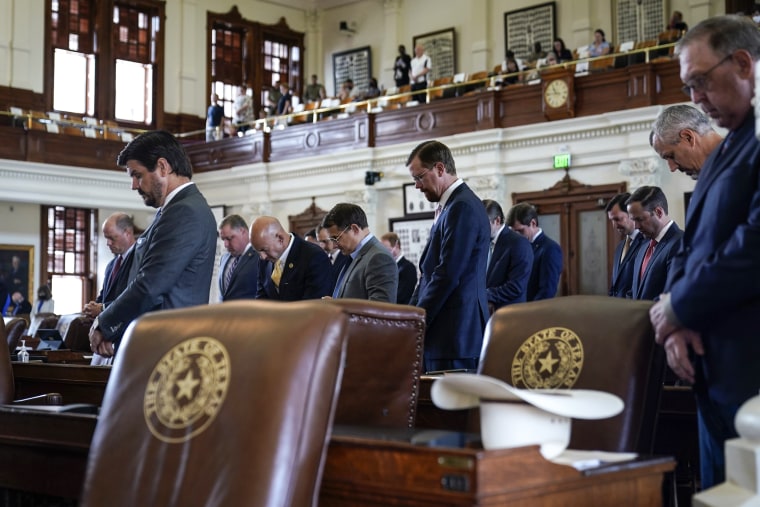 Image: Texas State Representatives pray in the House Chamber at the Texas Capitol as they prepare to debate voting bill SB1 on Aug. 26, 2021, in Austin, Texas.