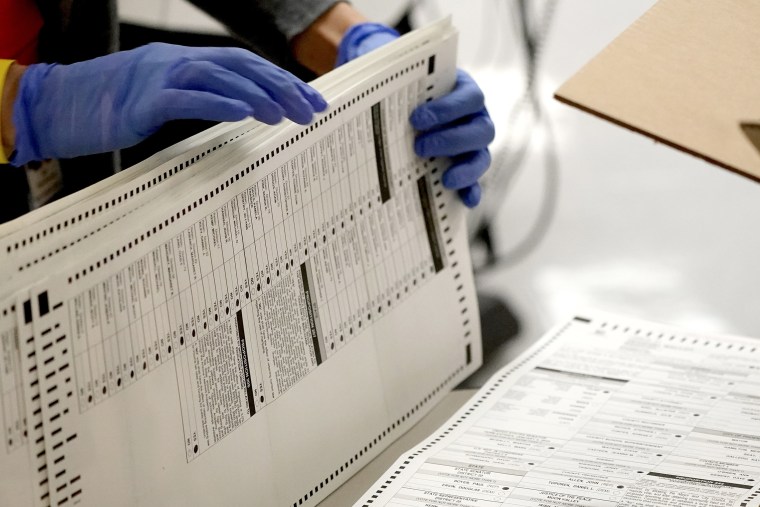 Image: Maricopa County elections officials count ballots at the Maricopa County Recorder's Office in Phoenix, on Nov. 4, 2020