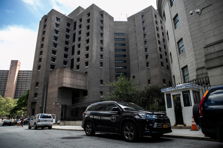 Image: A medical examiner vehicle at The Metropolitan Correctional Center in New York.