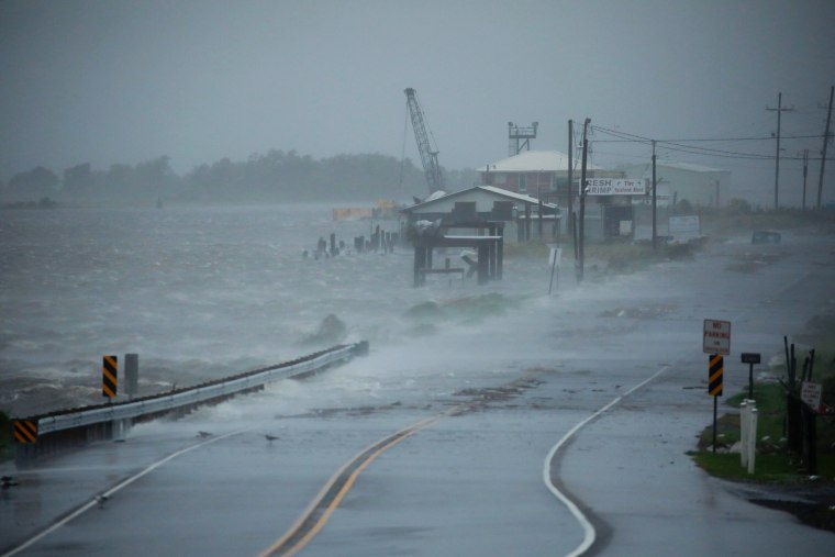 Storm surge begins to encroach on Louisiana Route 1 ahead of Hurricane Ida in Golden Meadow, La., on Aug. 29, 2021.