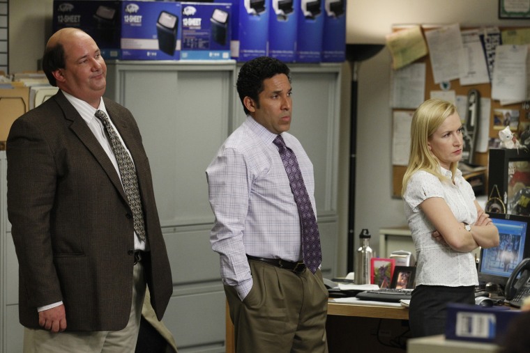 Pictured: (l-r) Brian Baumgartner as Kevin Malone, Oscar Nunez as Oscar Martinez, Angela Kinsey as Angela Martin