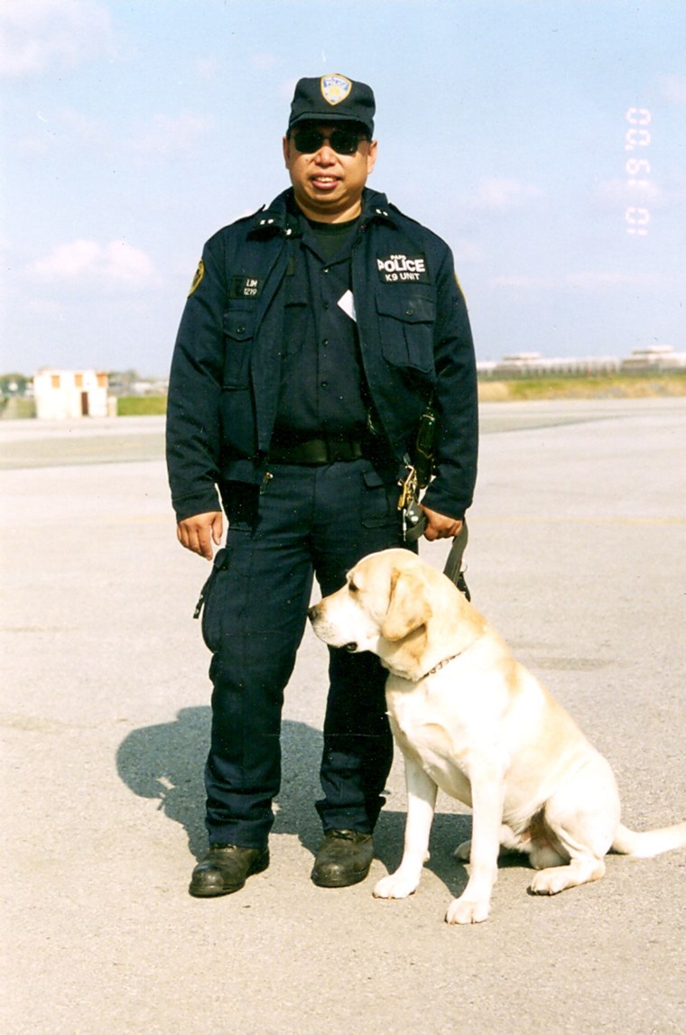Lim with his K-9, a yellow Labrador named Sirius, before the attacks. 