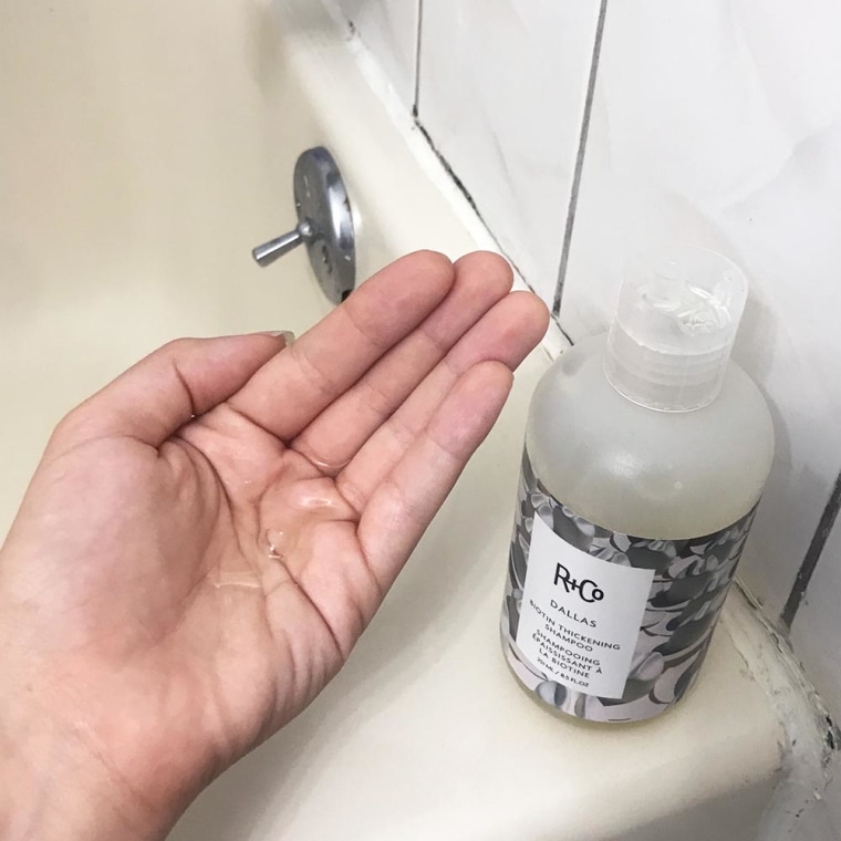 Image of Writer Cailey Rizzo holding Biotin shampoo