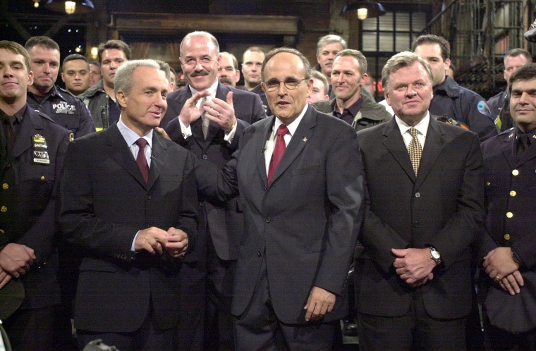 Publicity Still from Saturday Night Live Rudolph Giuliani and Lorne Michaels stand on stage with members of The New York City Police and Fire Departments circa 2001 File Reference # 30847453THA  For Editorial Use Only -  All Rights Reserved