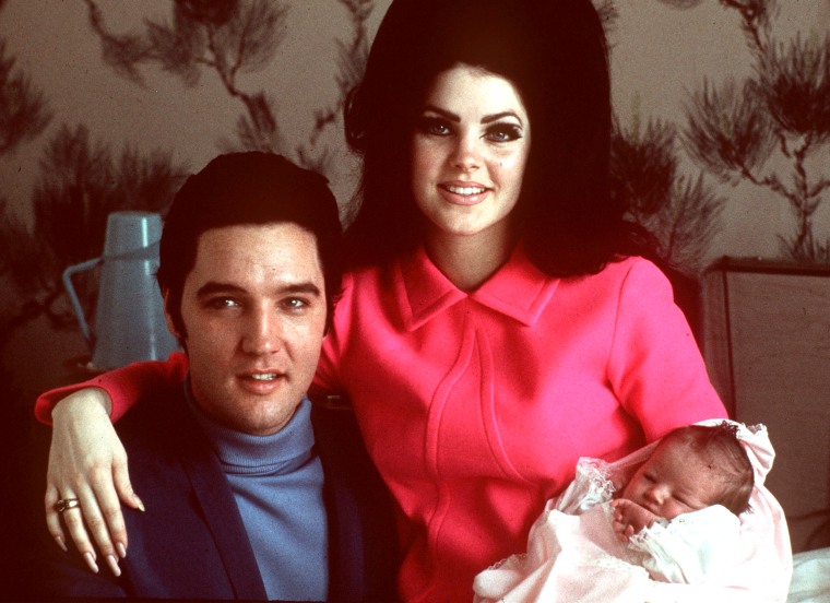 Elvis Presley poses with wife Priscilla