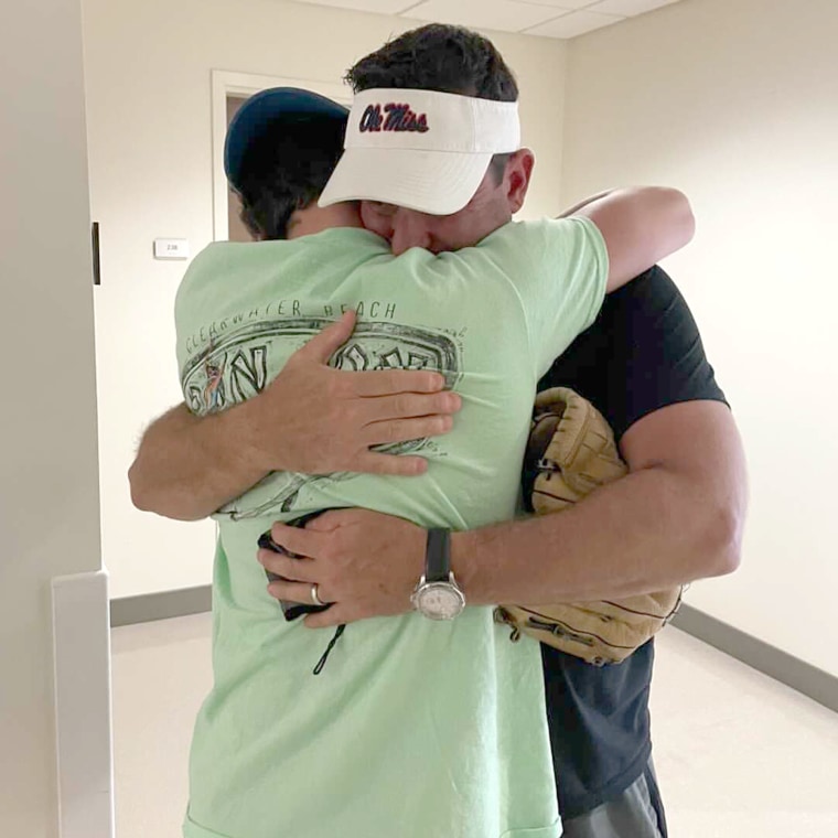 Zach and Ross Kellman get one last hug in at Zach's college drop-off at Ole Miss. 
