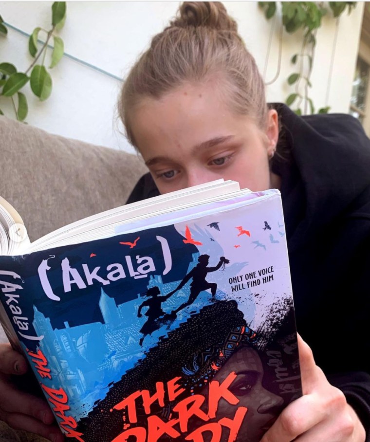 Angelina Jolie's child Shiloh Nouvel Jolie-Pitt reads a book