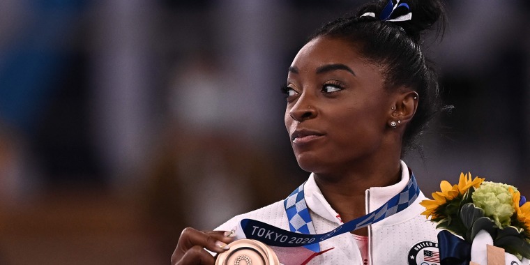 USA's Simone Biles poses with her bronze medal during the podium ceremony of the artistic gymnastics women's balance beam of the Tokyo 2020 Olympic Games at Ariake Gymnastics Centre in Tokyo.