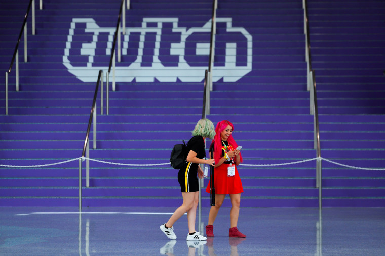 Image: FILE PHOTO: Attendees walk past a Twitch logo painted on stairs during opening day of E3, the annual video games expo revealing the latest in gaming software and hardware in Los Angeles