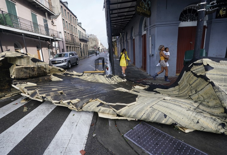Image: A section of roof that was blown off of a building in the French Quarter by Hurricane Ida winds blocks an intersection in New Orleans on Monday.