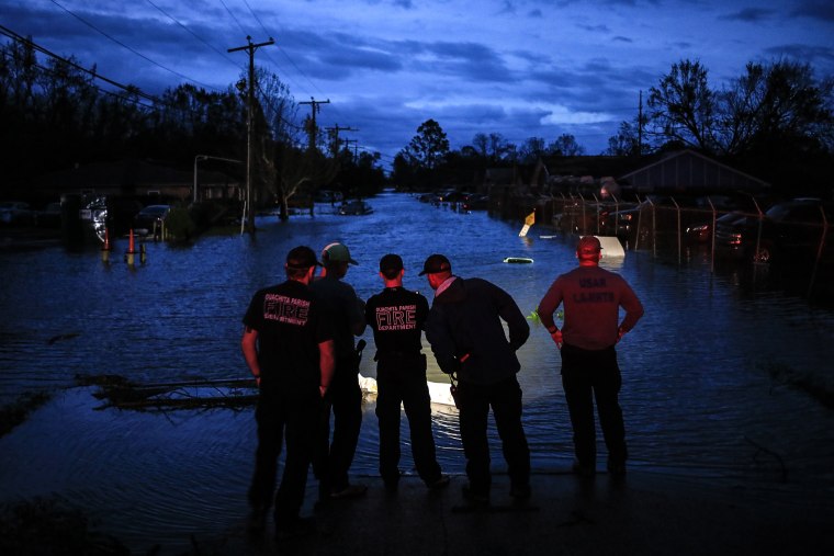 First responders prepare to launch rescue boats to transport residents out of floodwater left behind by Hurricane Ida in LaPlace, La., on Aug. 30, 2021.