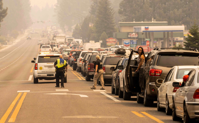 Image: Residents are stuck in gridlock while attempting to evacuate as the Caldor fire approaches in South Lake Tahoe, California on Aug. 30, 2021