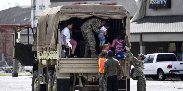 Image: A Louisiana National Guard truck assists people in Laplace, Louisiana on Monday after Hurricane Ida came ashore.