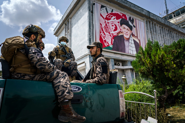 Taliban fighters patrol around the civilian terminal of the Hamid Karzai International Airport, after the full U.S. military withdrawal from the country, in Kabul, Afghanistan on Aug. 31, 2021.