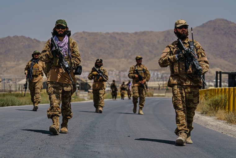 Image: Taliban fighters secure the outer perimeter, alongside the American controlled side of of the Hamid Karzai International Airport in Kabul, Afghanistan, on Aug. 29, 2021.