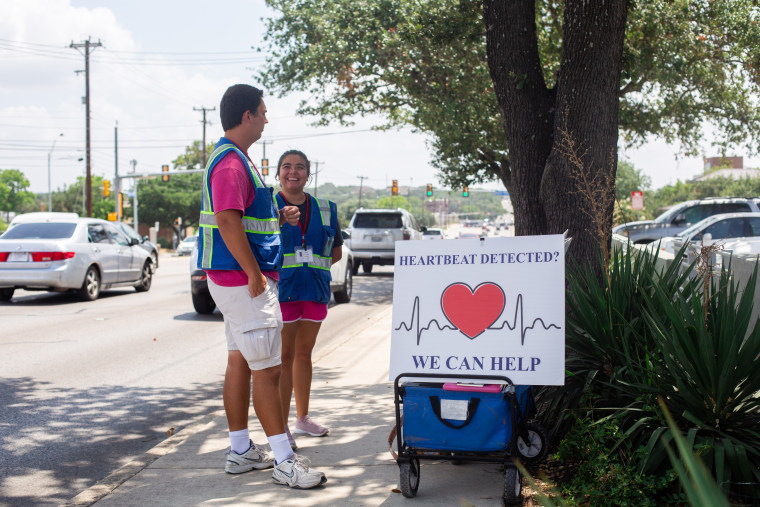 Interns for The San Antonio Coalition for Life stand outside Planned Parenthood in San Antonio on Sept. 2, 2021.