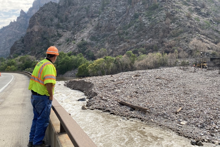 Image: Tim Holbrook overlooking Colorado River with mudslide debris