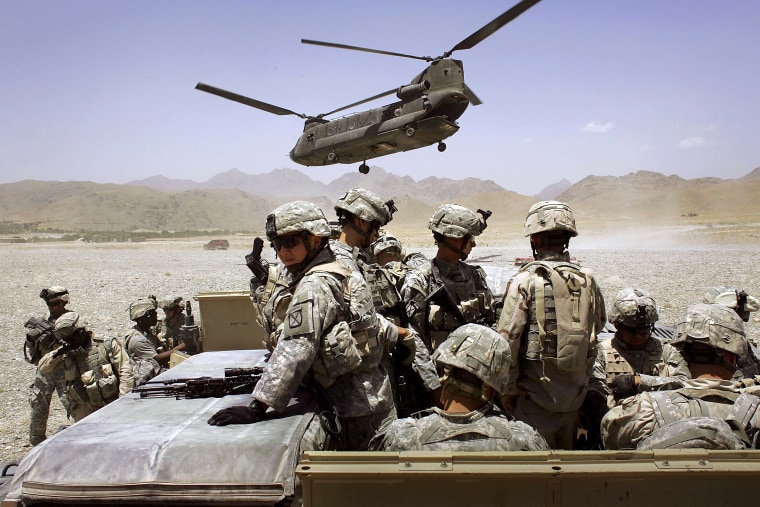 Image: American soldiers from the 10th Mountain Division leave for a base near the village of Deh Afghan in Afghanistan in 2006.