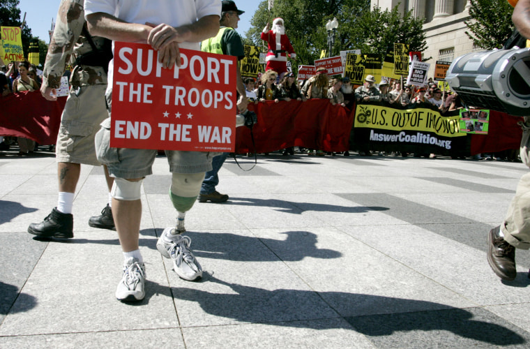 Image: A U.S. Army veteran who was injured in Afghanistan in 2004 protests during a march from the White House to the Capitol on Sept. 15, 2007.