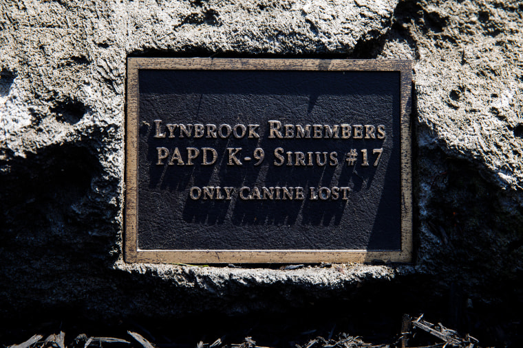 A plaque honors Sirius at a memorial site in Lynbrook, New York. 
